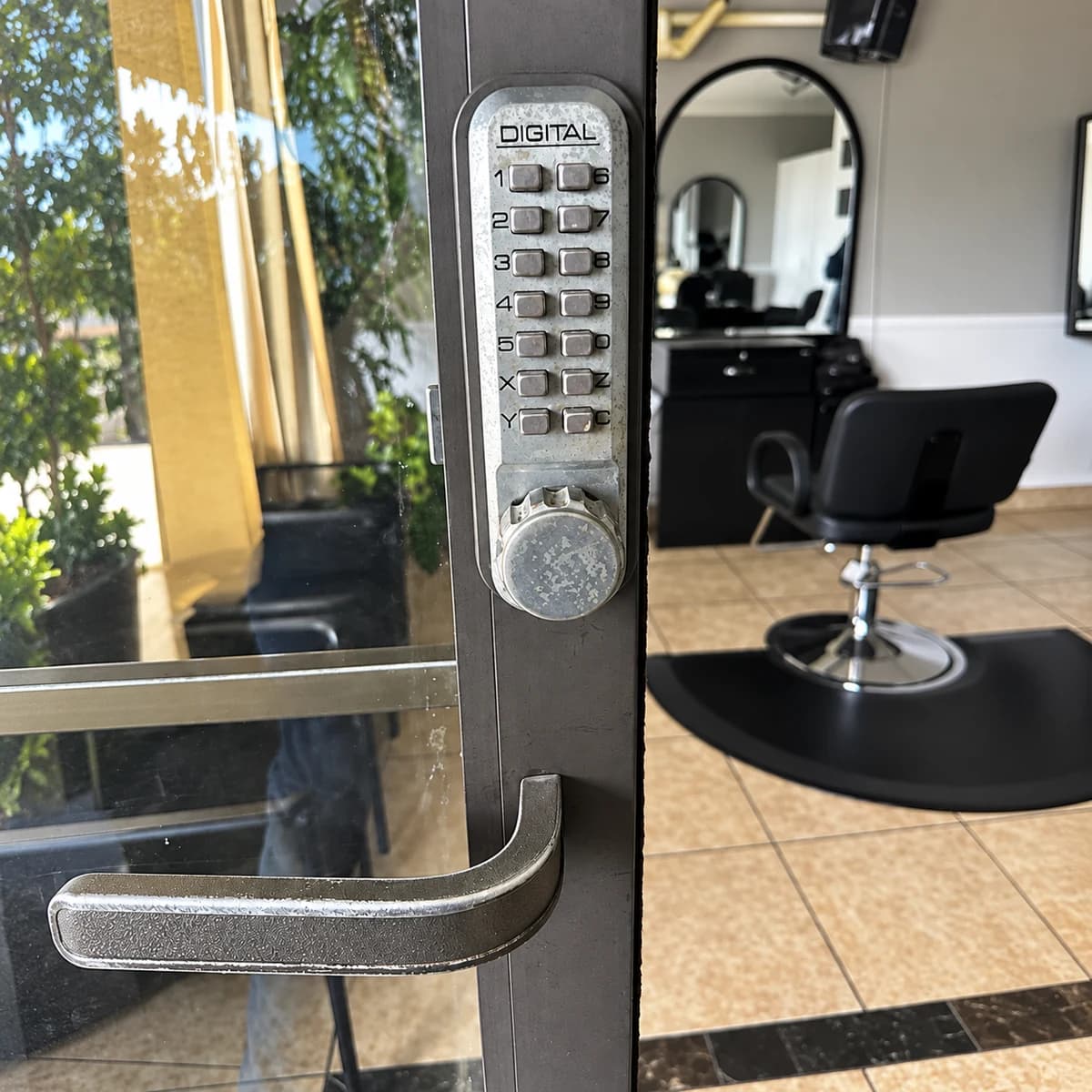 Keypad and lever on a glass entry door