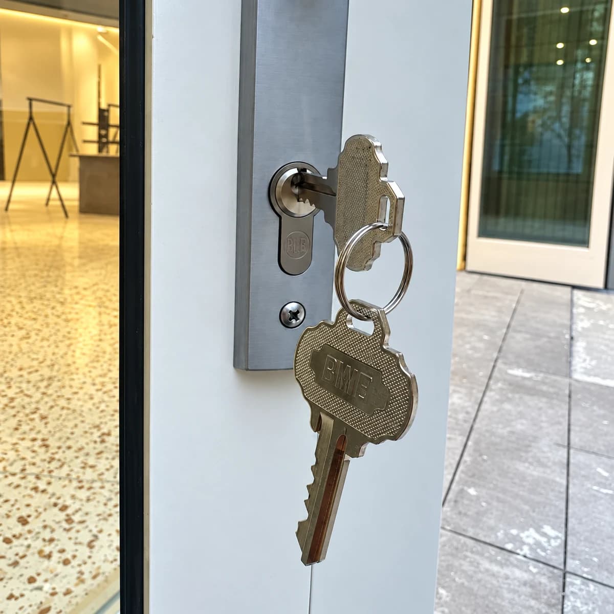 Keys in a cylinder on a glazed door